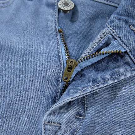 Dusk Blue High Rise Asymmetric Button Zip Fly Ripped Jeans
